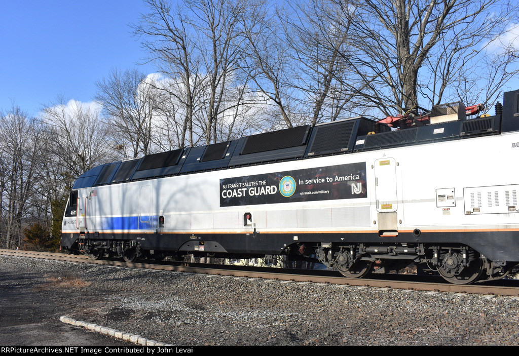 Rear side view of ALP-45DP # 4511 with a Coast Guard sign on it-this locomotive is the power for NJT Train # 5175 as it is about to depart White House